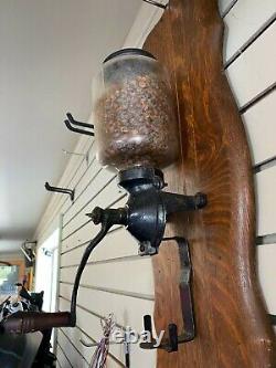 Antique ARCADE STYLE Coffee Grinder ON OAK WALL PLANK MANUFACTURE N/A