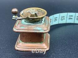 Antique Sewing Wind Up Tape Measure Figural Brass Copper Coffee Grinder c. 1900s