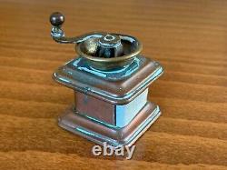 Antique Sewing Wind Up Tape Measure Figural Brass Copper Coffee Grinder c. 1900s