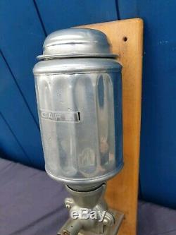 Antique Wall mounted coffee grinder art deco, cast aluminium. 1930s