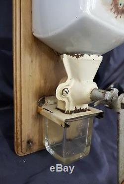 Antique Wall mounted coffee grinder ca. 1910 peacock