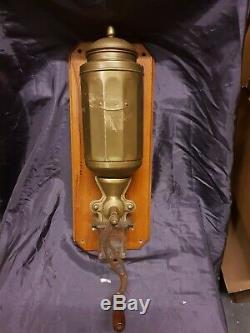 Antique brass. Wall mounted coffee grinder ca. 1930s