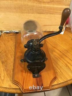 Vintage coffee grinder N C R A cast iron Mauntet On Black Off Wood Original Top