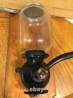 Vintage coffee grinder N C R A cast iron Mauntet On Black Off Wood Original Top